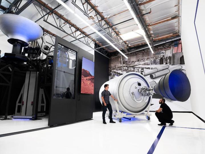 Relativity founders Tim Ellis and Jordan Noone examine the second stage of their Terran 1 rocket, which was entirely 3D-printed