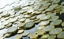Подешевевшая нефть заставляет тенге слабеть